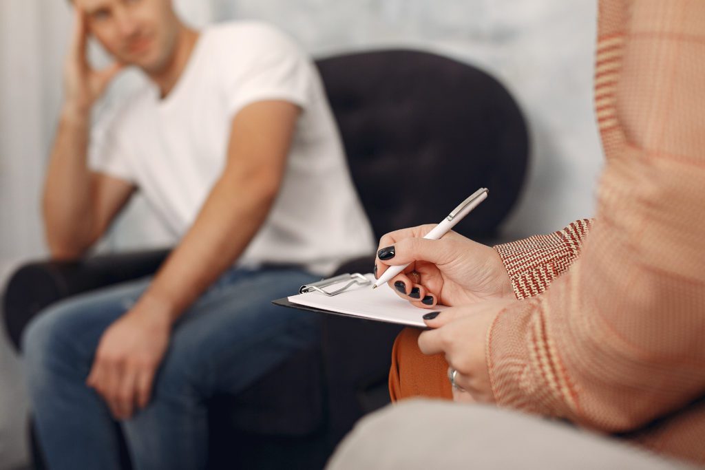 Man sitting in front of a psychologist